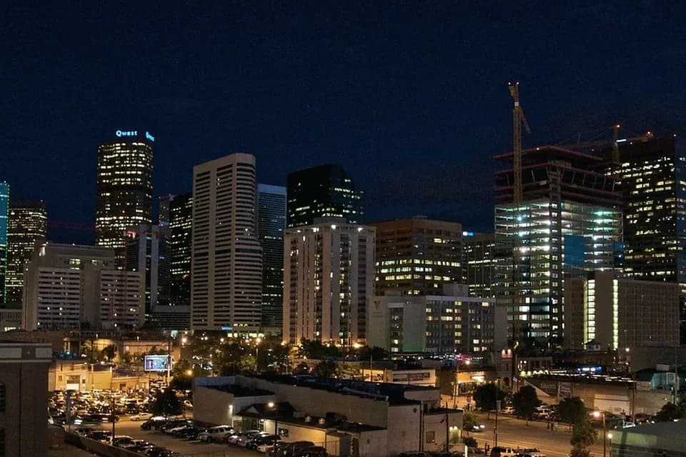 Downtown Denver skyline with the Rocky Mountains behind it